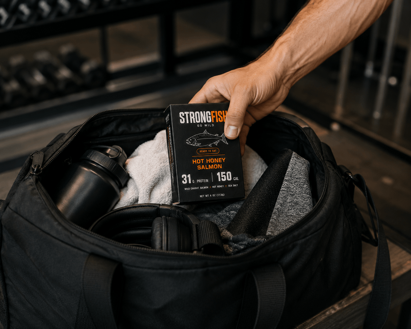 STRONGFISH carton tucked in a gym bag